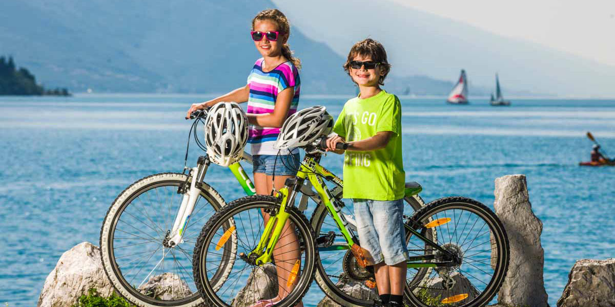 Family cycling in Lake Garda