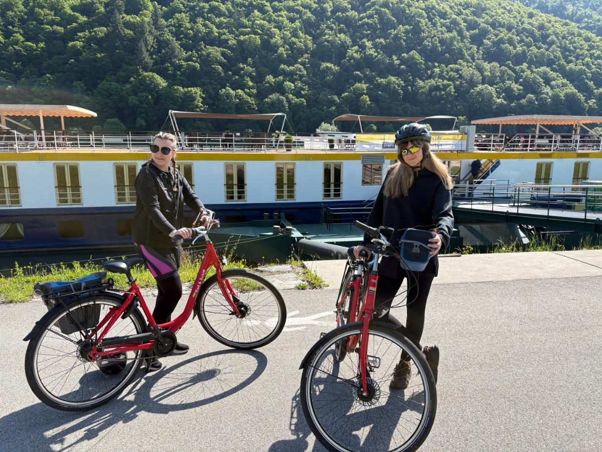Sales Consultant Arianna (right) ready to head out for the day on our Danube River 4 Countries Boat & Bike Tour Sales Consultant Arianna (right) ready to head out for the day on our Danube River 4 Countries Boat & Bike Tour