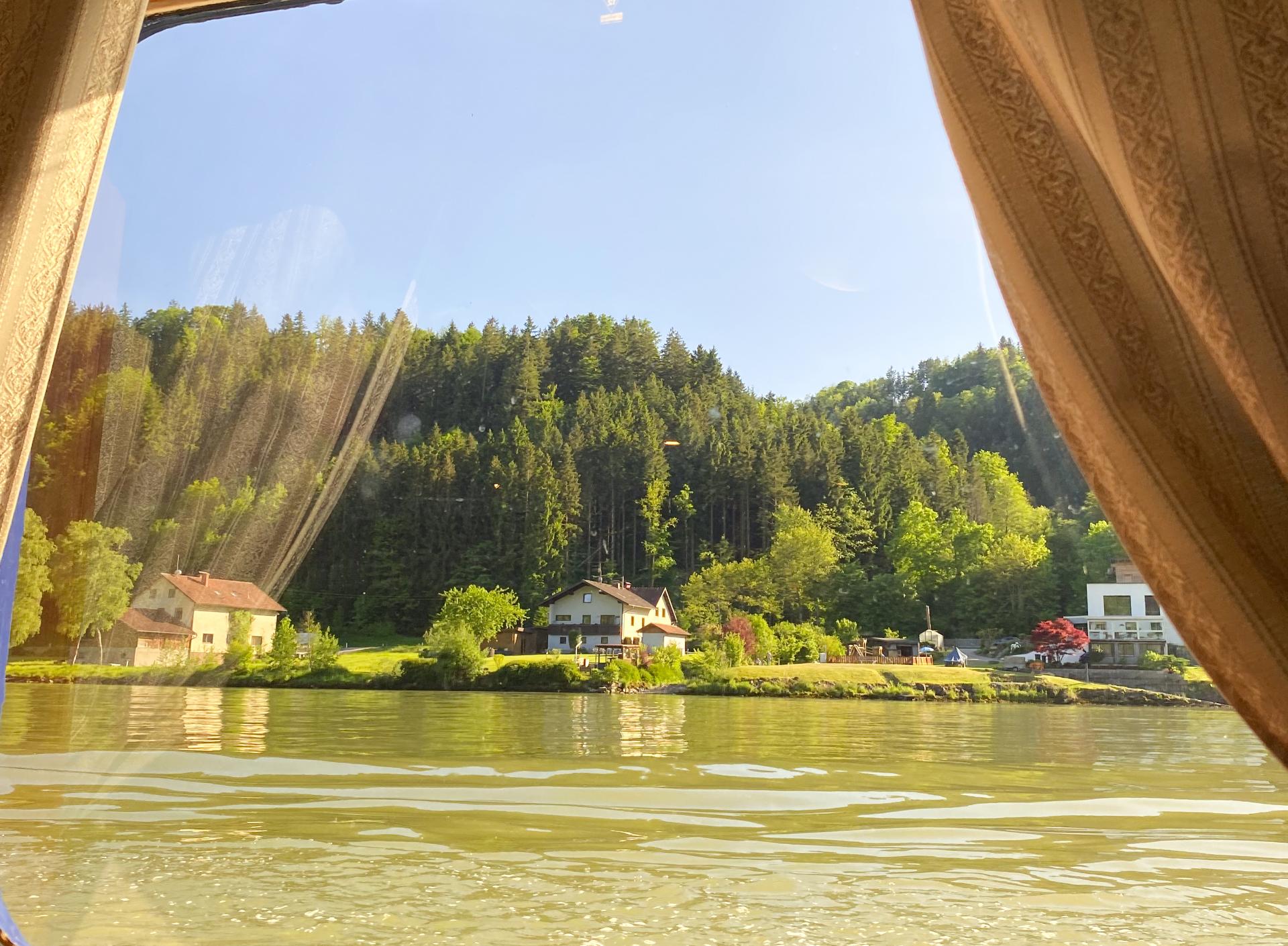 Glistening waters and idyllic views from Arianna's cabin window on our Danube River 4 Countries Boat & Bike Tour Glistening waters and idyllic views from Arianna's cabin window on our Danube River 4 Countries Boat & Bike Tour