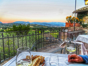 Umbria hotel terrace with wine and sunset